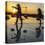 Vietnam. Doc Let Salt lake. Workers harvesting the salt. Early morning sunrise.-Tom Norring-Stretched Canvas