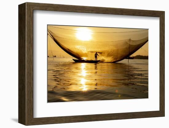 Vietnam. Fisherman emptying the nights catch in the Lagoon.-Tom Norring-Framed Photographic Print