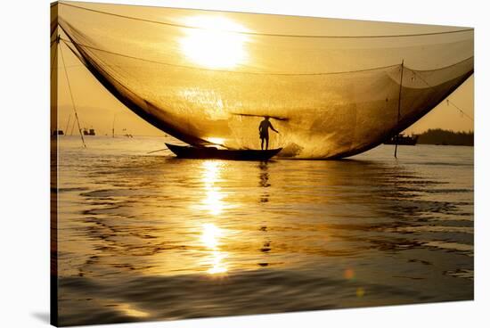 Vietnam. Fisherman emptying the nights catch in the Lagoon.-Tom Norring-Stretched Canvas