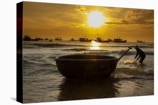 Vietnam. Fishermen deliver the nights catch to the beach at Hoi An.-Tom Norring-Stretched Canvas