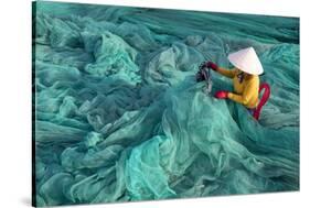 Vietnam. Fishing net analysis and repair with old fashioned manual sowing machine.-Tom Norring-Stretched Canvas
