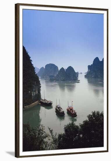 Vietnam, Halong Bay, Tourist Boats Anchor at the Cave of Marvels-Walter Bibikow-Framed Premium Photographic Print