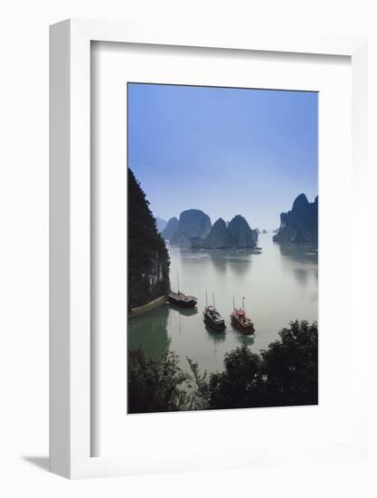 Vietnam, Halong Bay, Tourist Boats Anchor at the Cave of Marvels-Walter Bibikow-Framed Photographic Print