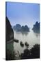 Vietnam, Halong Bay, Tourist Boats Anchor at the Cave of Marvels-Walter Bibikow-Stretched Canvas