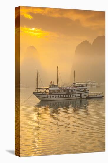 Vietnam, Halong Bay, Tourist Boats, Sunrise-Walter Bibikow-Stretched Canvas