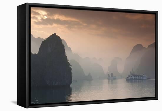 Vietnam, Halong Bay, Tourist Boats, Sunrise-Walter Bibikow-Framed Stretched Canvas