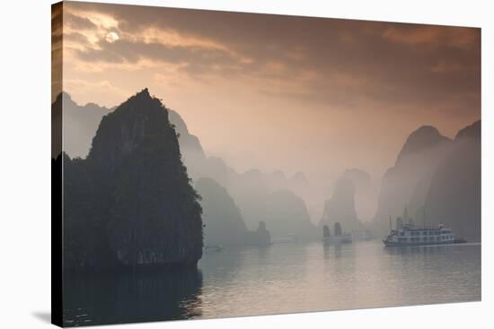 Vietnam, Halong Bay, Tourist Boats, Sunrise-Walter Bibikow-Stretched Canvas