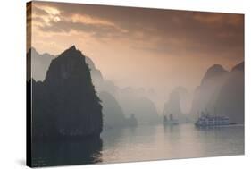 Vietnam, Halong Bay, Tourist Boats, Sunrise-Walter Bibikow-Stretched Canvas