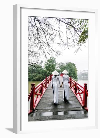 Vietnam, Hanoi, Hoan Kiem Lake. Walking on Huc Bridge in Traditional Ao Dai Dress-Matteo Colombo-Framed Photographic Print