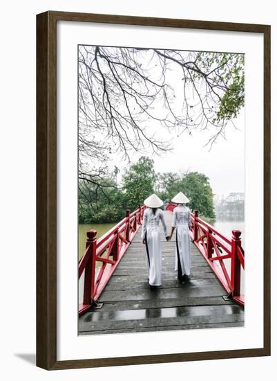 Vietnam, Hanoi, Hoan Kiem Lake. Walking on Huc Bridge in Traditional Ao Dai Dress-Matteo Colombo-Framed Photographic Print