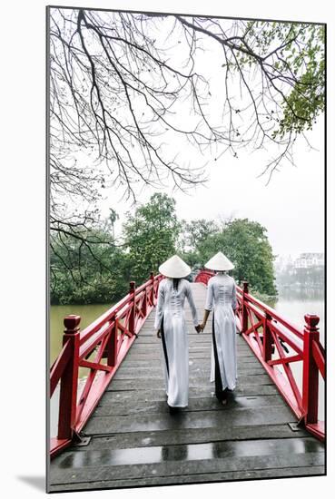 Vietnam, Hanoi, Hoan Kiem Lake. Walking on Huc Bridge in Traditional Ao Dai Dress-Matteo Colombo-Mounted Photographic Print