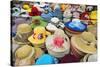 Vietnam, Ho Chi Minh Province, Ho Chi Minh City, Saigon. Hats Galore! a Stall in Saigon Market.-Nigel Pavitt-Stretched Canvas