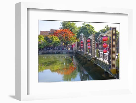 Vietnam. Hoi An bridge over the river with reflections and silk lamps.-Tom Norring-Framed Photographic Print