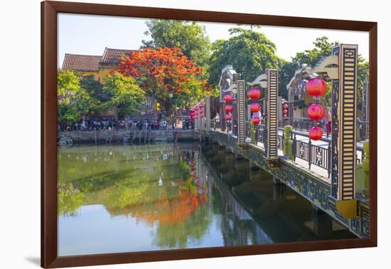 Vietnam. Hoi An bridge over the river with reflections and silk lamps.-Tom Norring-Framed Photographic Print