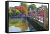 Vietnam. Hoi An bridge over the river with reflections and silk lamps.-Tom Norring-Framed Stretched Canvas