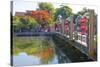 Vietnam. Hoi An bridge over the river with reflections and silk lamps.-Tom Norring-Stretched Canvas