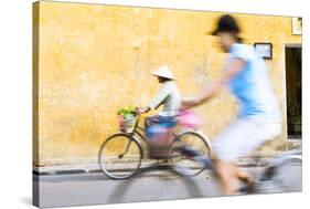 Vietnam, Hoi An. Local People on Bicycle in the Streets of the Town-Matteo Colombo-Stretched Canvas