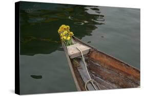 Vietnam, Hoi An, Quang Nam. Traditional Boat with Flowers on the Bow-Kevin Oke-Stretched Canvas