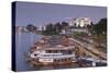 Vietnam, Hue. Cityscape with the Perfume River and Dragon Boats at Dusk-Walter Bibikow-Stretched Canvas