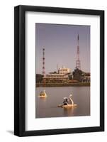 Vietnam, Hue. Perfume River and Tourist Swan Boats, Sunset-Walter Bibikow-Framed Photographic Print