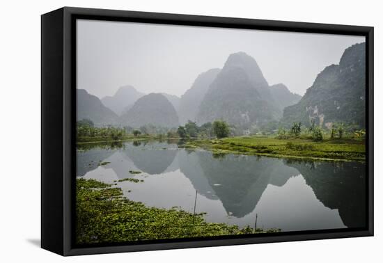 Vietnam, Ninh Binh. Limestone Karsts, with Reflection, in Fog-Matt Freedman-Framed Stretched Canvas