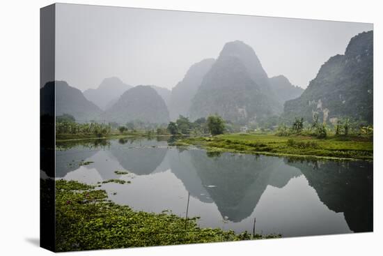 Vietnam, Ninh Binh. Limestone Karsts, with Reflection, in Fog-Matt Freedman-Stretched Canvas