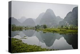 Vietnam, Ninh Binh. Limestone Karsts, with Reflection, in Fog-Matt Freedman-Stretched Canvas