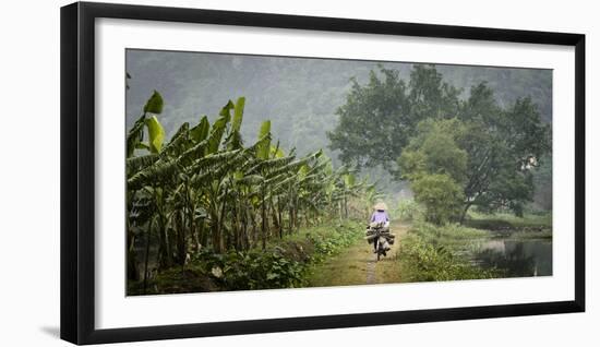 Vietnam, Ninh Binh. Woman on Bicycle Riding Away on Path-Matt Freedman-Framed Premium Photographic Print