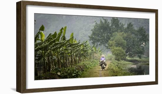 Vietnam, Ninh Binh. Woman on Bicycle Riding Away on Path-Matt Freedman-Framed Photographic Print