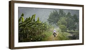 Vietnam, Ninh Binh. Woman on Bicycle Riding Away on Path-Matt Freedman-Framed Photographic Print