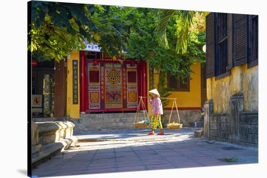 Vietnam. Woman with vegetable basket for sale.-Tom Norring-Stretched Canvas