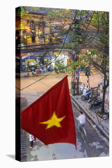 Vietnamese Flag and Street Scene, Hanoi, Vietnam-Peter Adams-Stretched Canvas