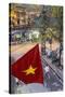 Vietnamese Flag and Street Scene, Hanoi, Vietnam-Peter Adams-Stretched Canvas