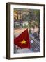 Vietnamese Flag and Street Scene, Hanoi, Vietnam-Peter Adams-Framed Photographic Print