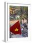 Vietnamese Flag and Street Scene, Hanoi, Vietnam-Peter Adams-Framed Photographic Print