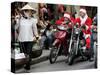 Vietnamese Men Dressed as Santa Claus Wait on their Motorbikes on a Street in Hanoi, Vietnam-null-Stretched Canvas
