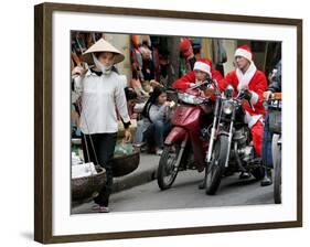 Vietnamese Men Dressed as Santa Claus Wait on their Motorbikes on a Street in Hanoi, Vietnam-null-Framed Photographic Print