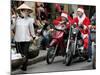 Vietnamese Men Dressed as Santa Claus Wait on their Motorbikes on a Street in Hanoi, Vietnam-null-Mounted Photographic Print