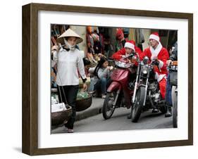 Vietnamese Men Dressed as Santa Claus Wait on their Motorbikes on a Street in Hanoi, Vietnam-null-Framed Photographic Print