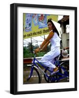 Vietnamese woman cycles in white clothes and hat-Charles Bowman-Framed Photographic Print