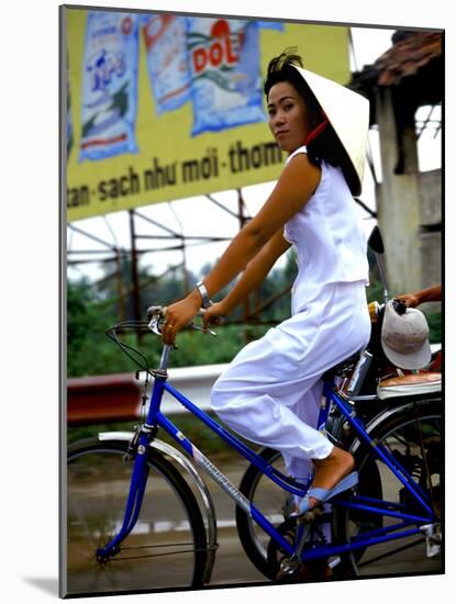 Vietnamese woman cycles in white clothes and hat-Charles Bowman-Mounted Photographic Print