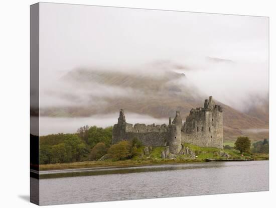 View across Loch Awe to the Ruins of Kilchurn Castle, Early Morning Mist on Mountains-Ruth Tomlinson-Stretched Canvas