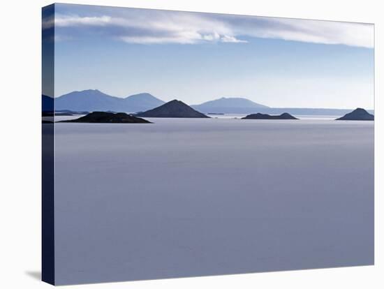 View across Salar De Uyuni, the Largest Salt Flat in World, Towards the Distant Andean Peaks-John Warburton-lee-Stretched Canvas