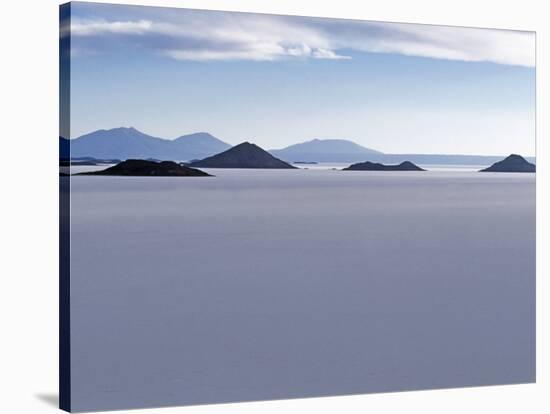 View across Salar De Uyuni, the Largest Salt Flat in World, Towards the Distant Andean Peaks-John Warburton-lee-Stretched Canvas