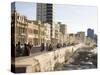 View Along the Malecon, People Sitting on the Seawall Enjoying the Evening Sunshine, Havana, Cuba-Lee Frost-Stretched Canvas