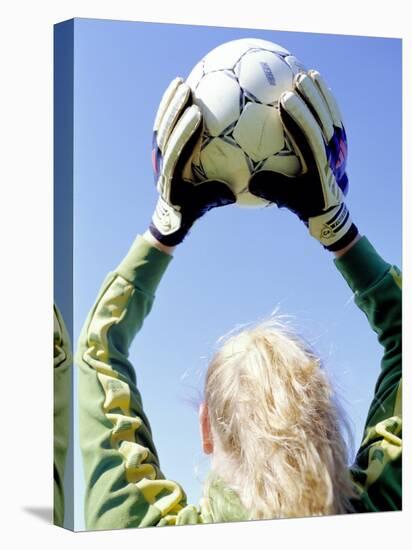 View from Behind of a Girl Holding a Soccer Ball-Steve Cicero-Stretched Canvas