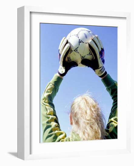 View from Behind of a Girl Holding a Soccer Ball-Steve Cicero-Framed Photographic Print