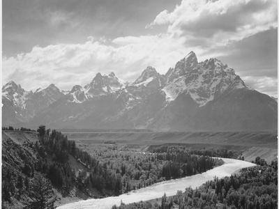 https://imgc.allpostersimages.com/img/posters/view-from-river-valley-towards-snow-covered-mts-river-in-fgnd-grand-teton-np-wyoming-1933-1942_u-L-Q19QUX50.jpg?artPerspective=n