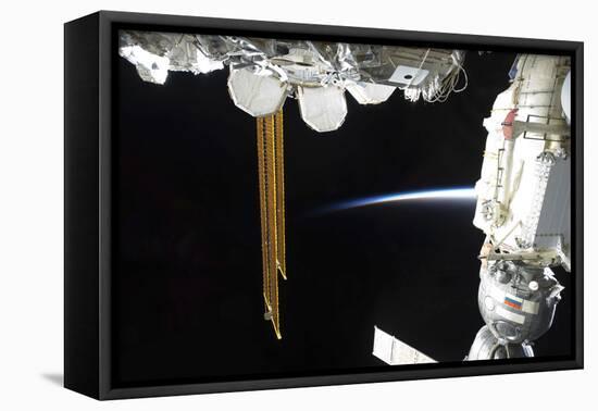 View of a Docked Russian Soyuz Spacecraft and Part of the International Space Station-null-Framed Stretched Canvas