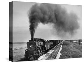View of a Freight Train Crossing an Open Prairie-Thomas D^ Mcavoy-Stretched Canvas